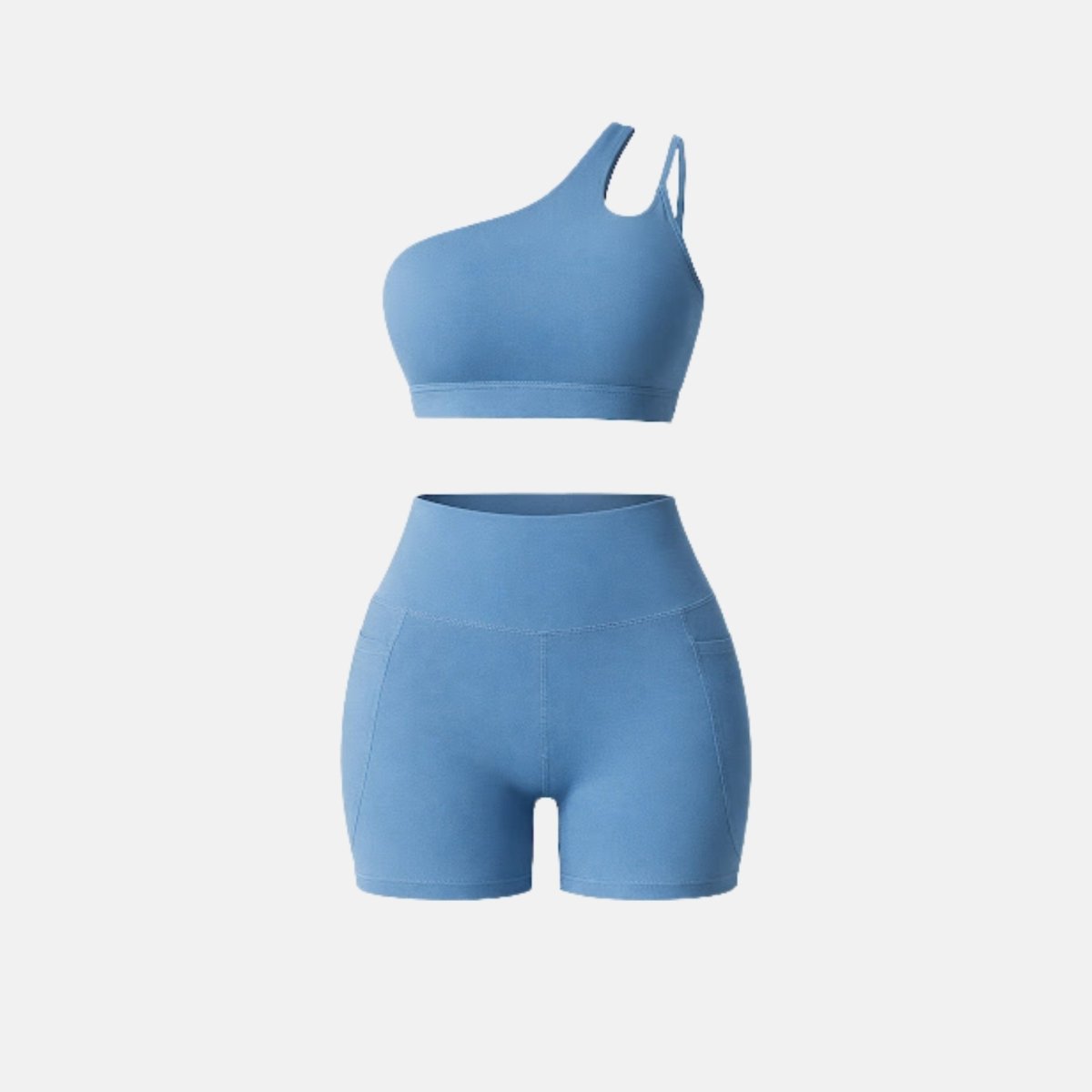 Front view of luxury light blue matching workout set featuring one-shoulder crop top and pocket biker shorts against a clean white background.