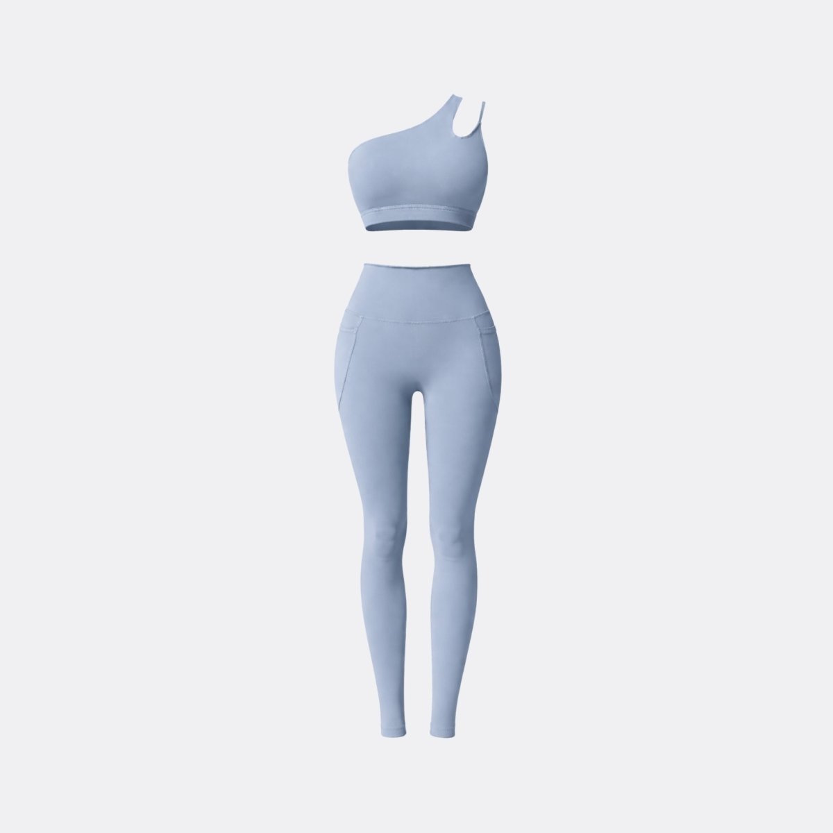 Flat lay style image of Kouvr light blue asymmetrical sports bra and high waisted leggings two piece workout outfit.