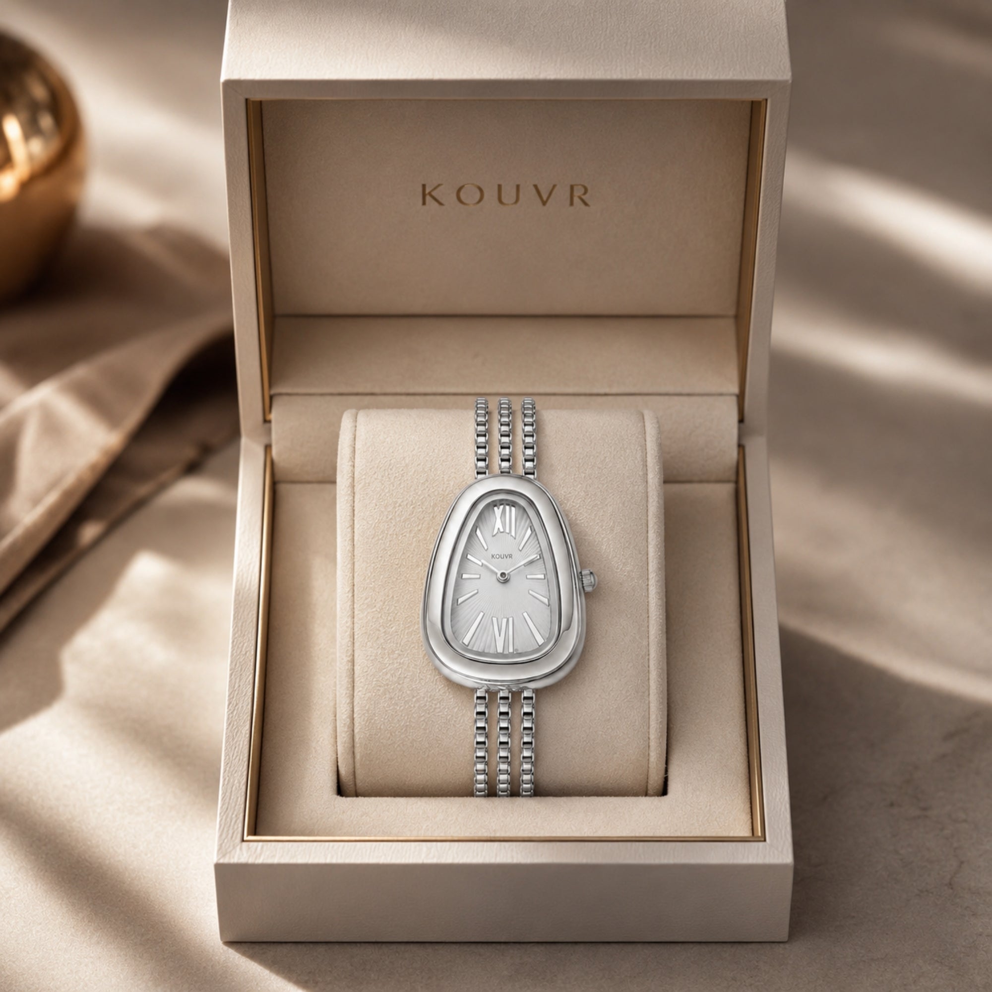 Kouvr luxury women's vintage style silver watch with textured sunray dial displayed elegantly inside a protective cream presentation box.