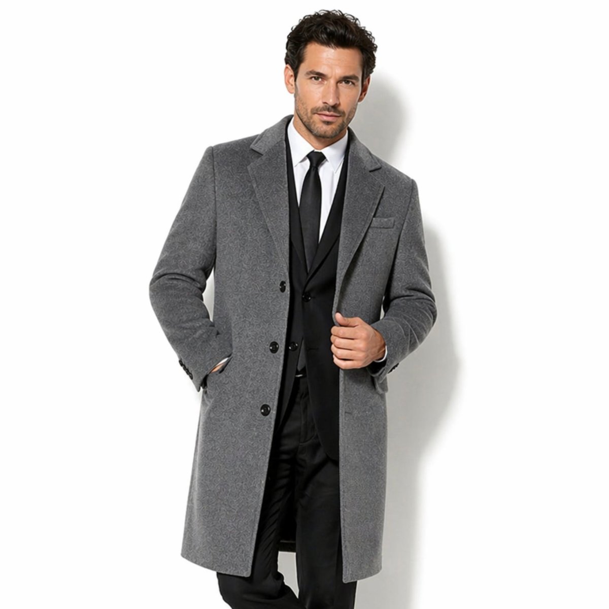 Front view of Kouvr men's grey tailored overcoat featuring a single breasted wool blend topcoat design over a black suit, ideal for formal winter styling.
