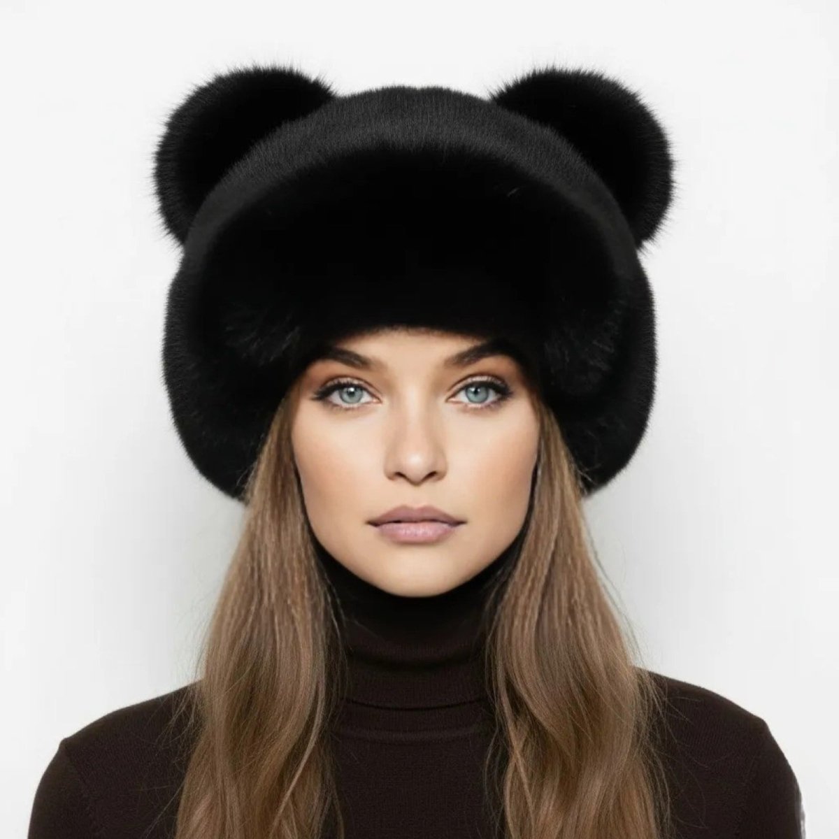 A model with blue eyes wearing the Kouvr jet black mink fur bear ear hat as a statement winter accessory with a dark brown turtleneck.