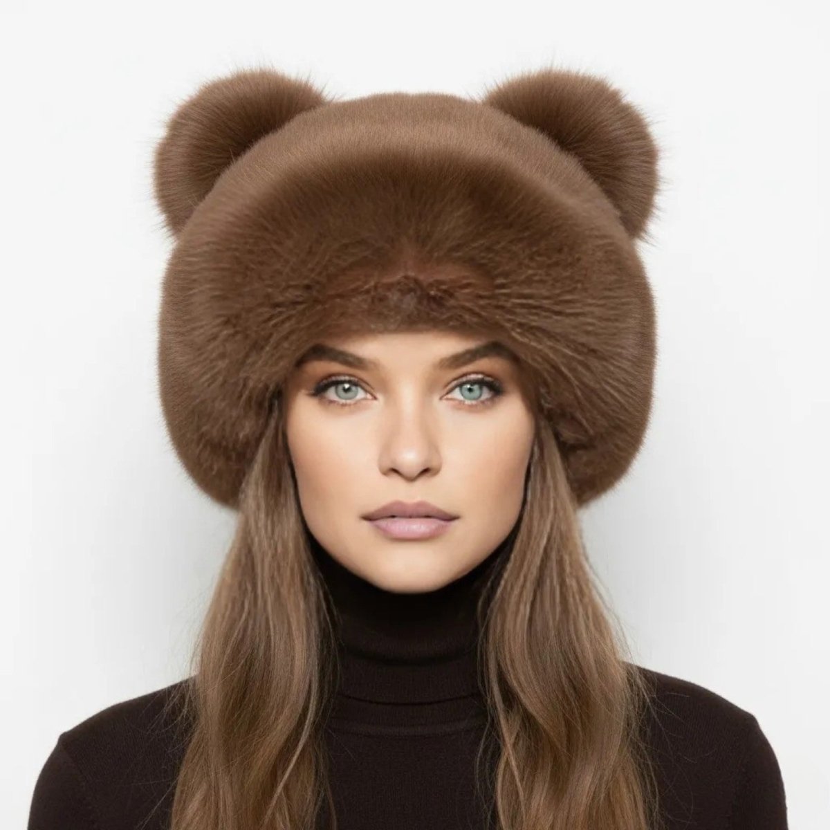 A model with blue eyes looking directly at the camera while wearing the Kouvr brown mink fur bear ear hat, perfect for après-ski style.