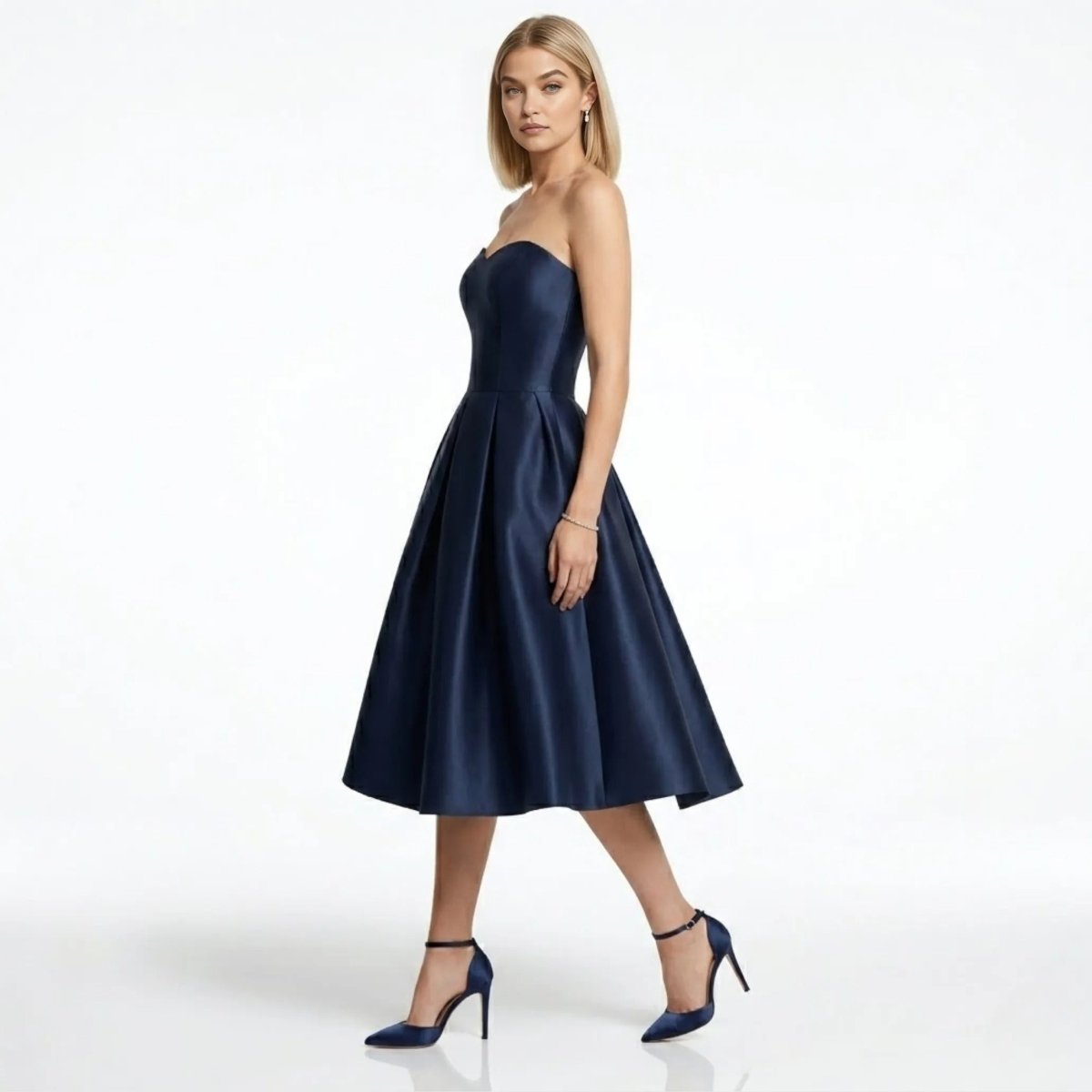 Woman wearing affordable luxury fit and flare dark blue cocktail dress side profile.