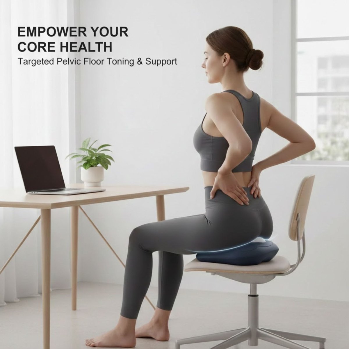 Woman using the Kouvr Elite trainer on an office chair for targeted pelvic floor toning while working.