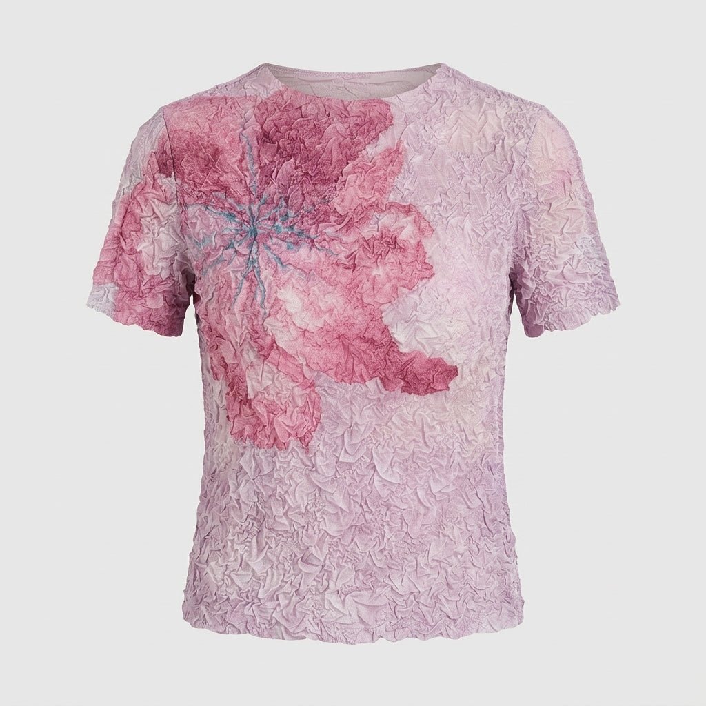 Flat lay studio shot of Kouvr pink floral textured popcorn t-shirt showing vibrant flower print