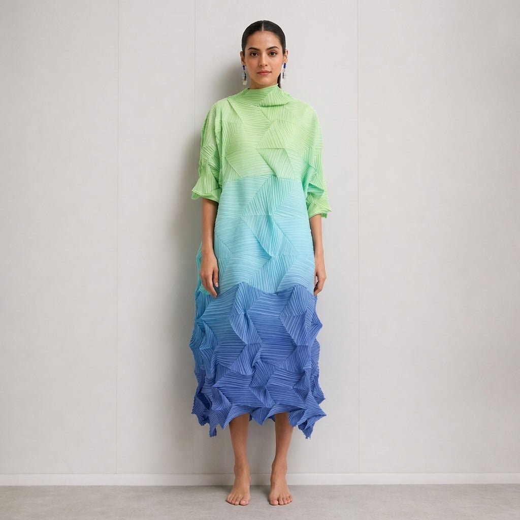 Front view of the Kouvr pleated ombre midi dress in green and blue gradient featuring a high mock neck and 3D geometric texture.