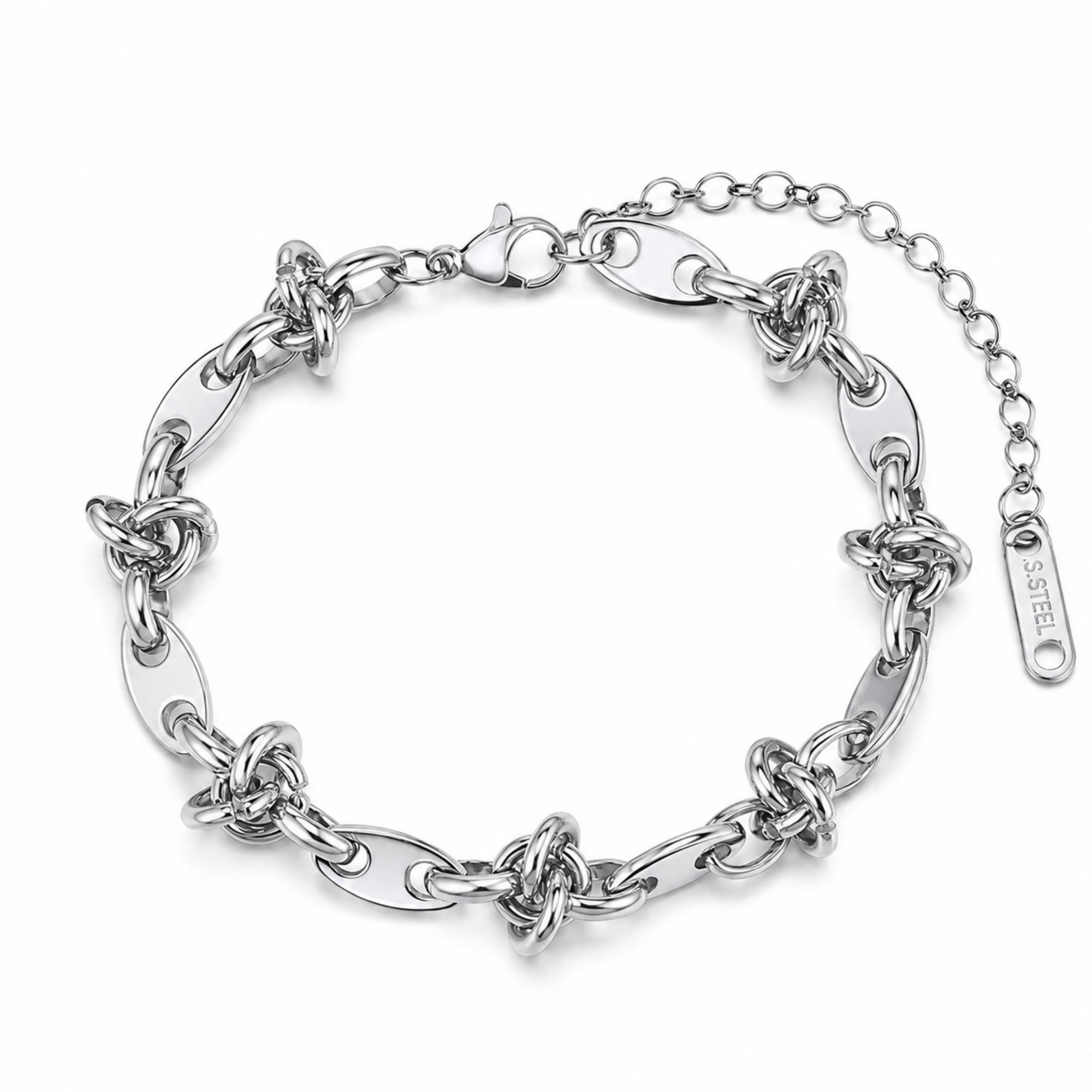 Polished silver stainless steel chunky interlocking knot link bracelet resting elegantly on a luxurious marble and silk surface.