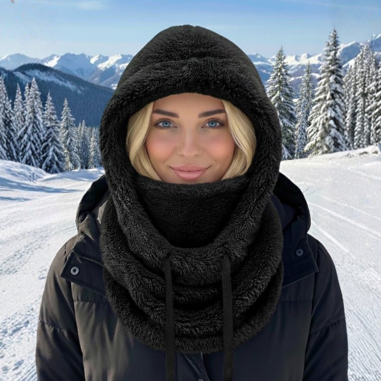 Woman wearing black premium fleece balaclava hood for skiing and snowboarding.