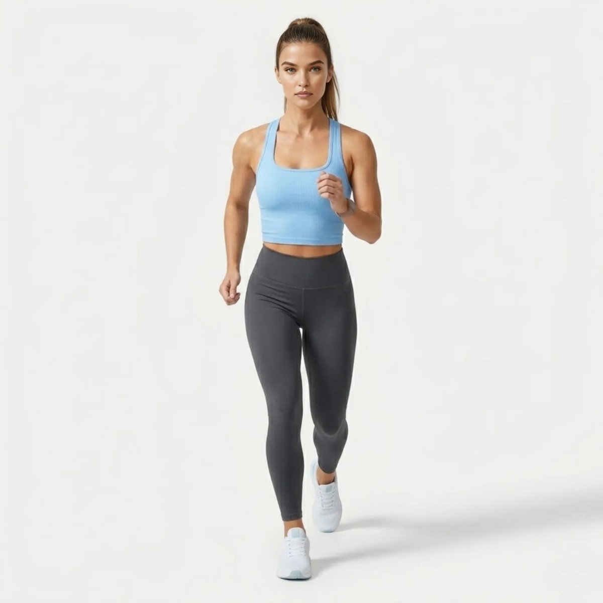 Woman wearing premium light blue gym and yoga crop top walking