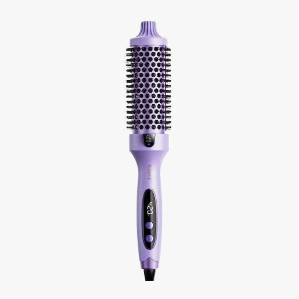 Purple thermal brush by Kouvr with 1.5 inch heated barrel and adjustable heat settings for salon-quality blowouts at home.