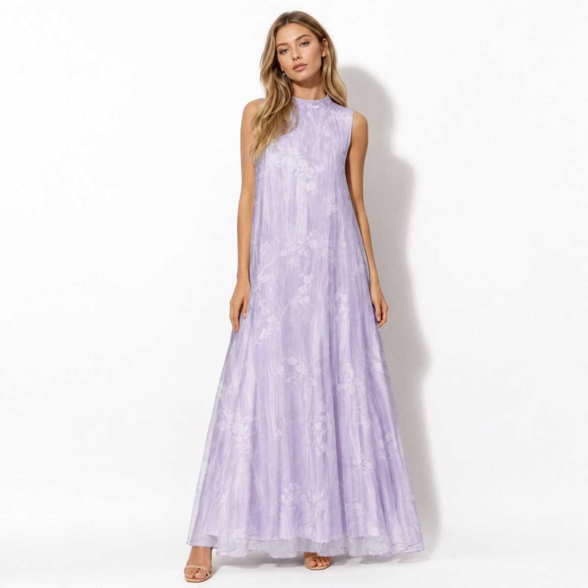 Woman wearing a luxury purple floral high neck sleeveless maxi dress by Kouvr