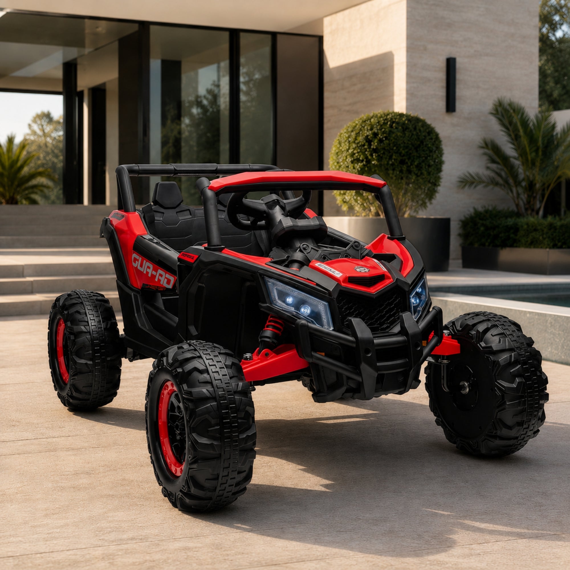 A bright red 24V power wheels style UTV toy vehicle with aggressive off-road styling and high-intensity headlights positioned on a stone courtyard.