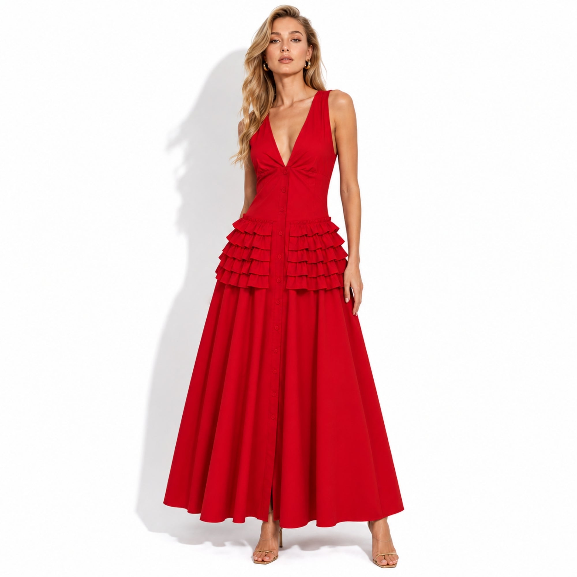 Model showcasing the vibrant red a-line ruffled cocktail dress with functional front buttons by luxury brand Kouvr.