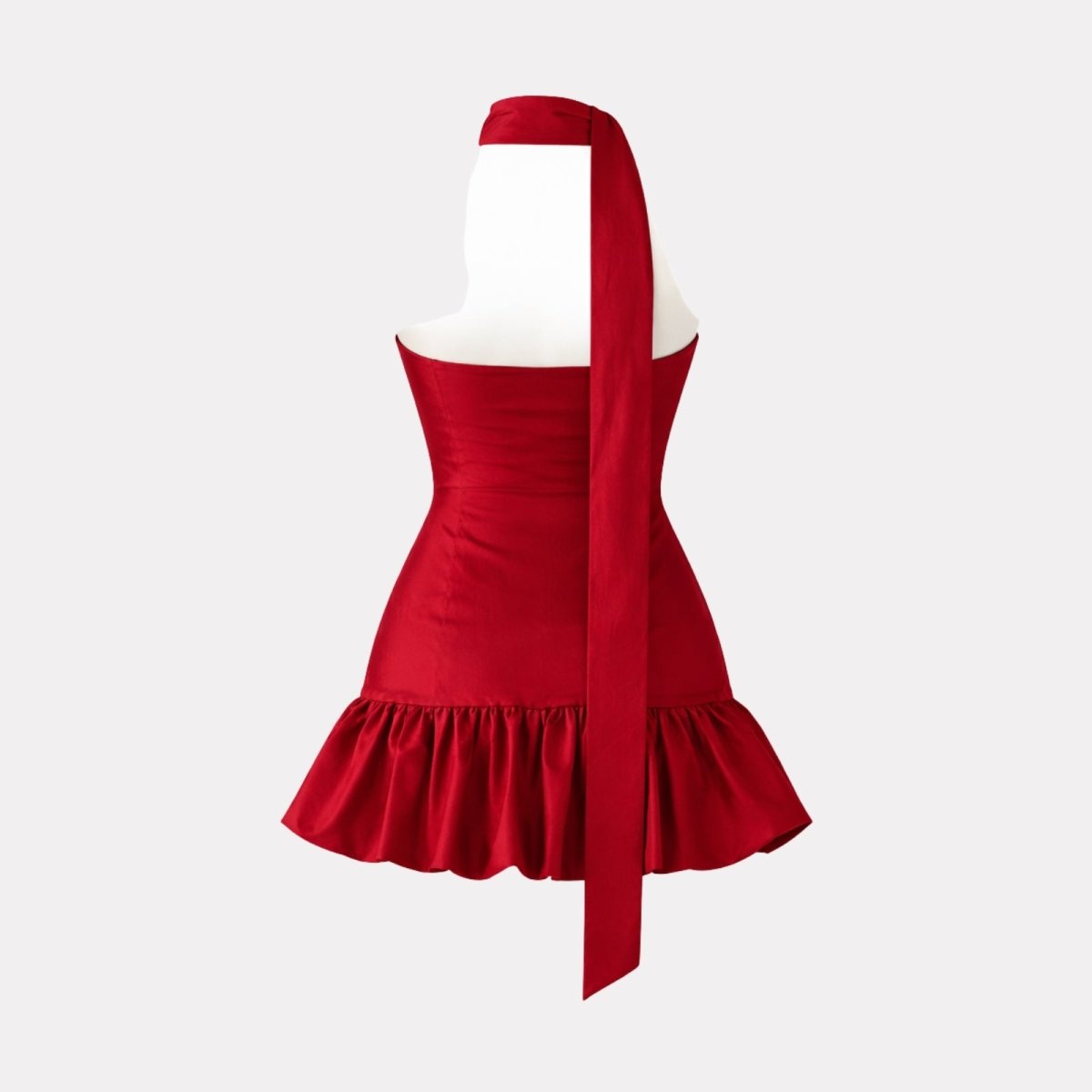 Product-only studio shot from the back of the Kouvr red halter mini dress, displaying the long sash tie.