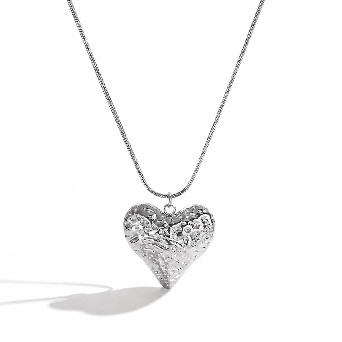 Minimalist silver hammered heart pendant necklace crafted from perfectly polished tarnish resistant stainless steel