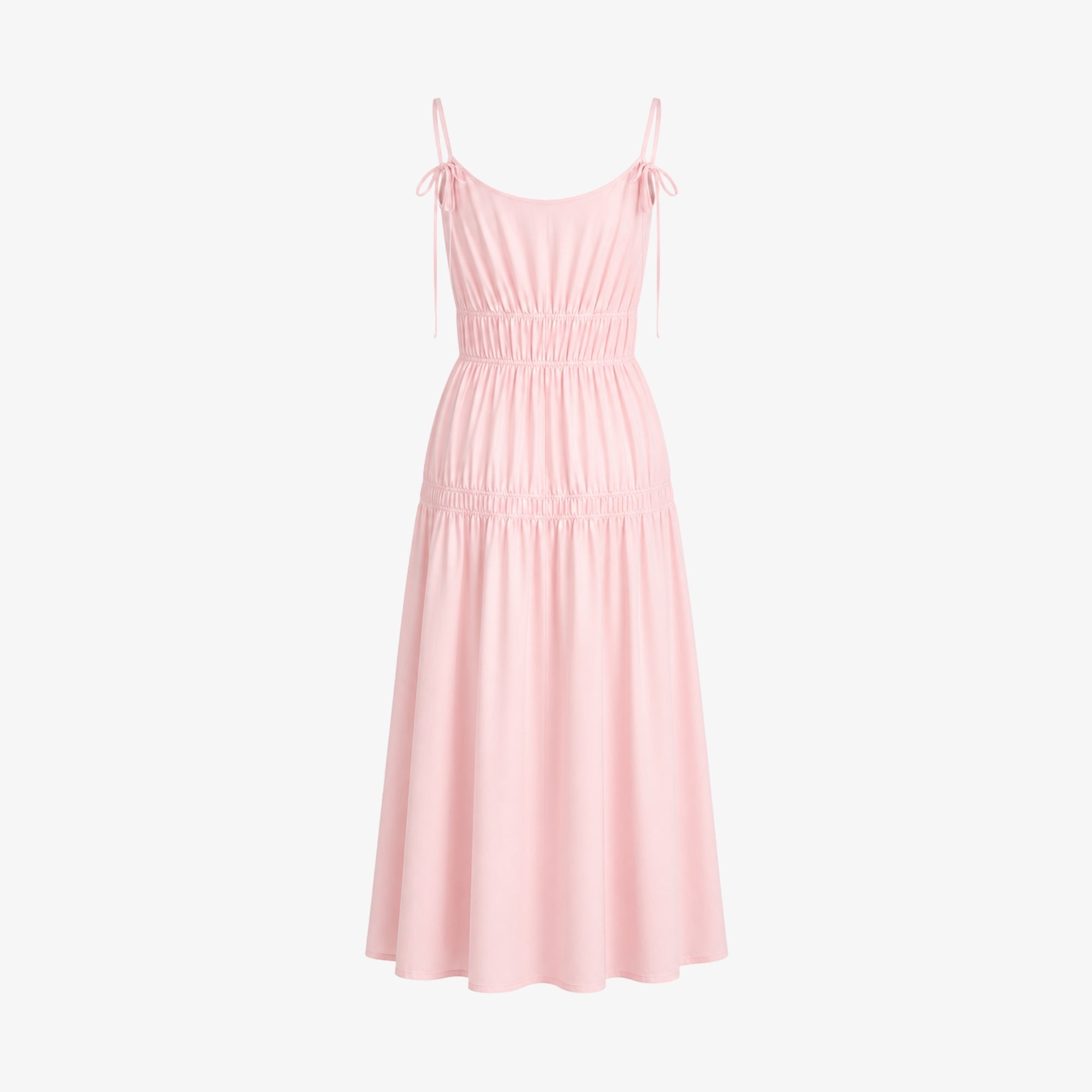 Flat lay back view of light pink tie strap tiered summer gown