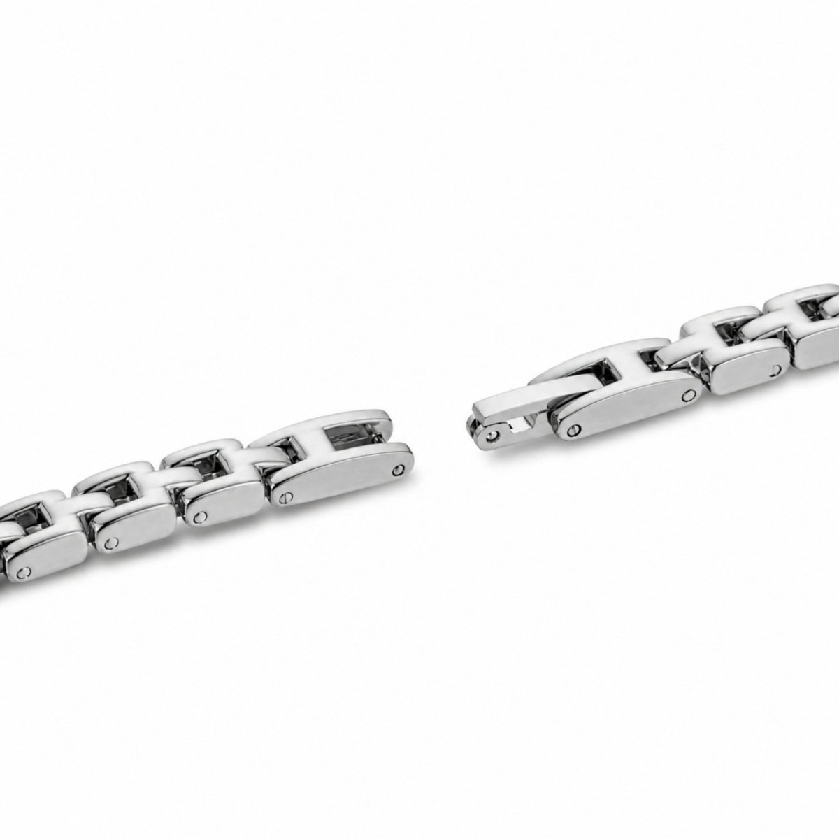 Extreme close up macro detail of the stainless steel adjustable jewelry clasp and removable links on the Kouvr ladies watch strap