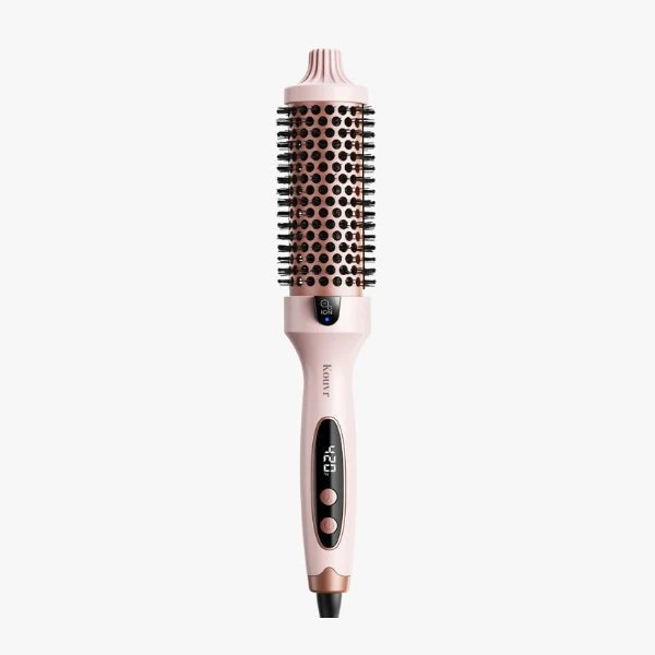 Pink Kouvr thermal brush with rose gold ceramic barrel and digital temperature display showing 420 degrees for creating frizz-free volume.