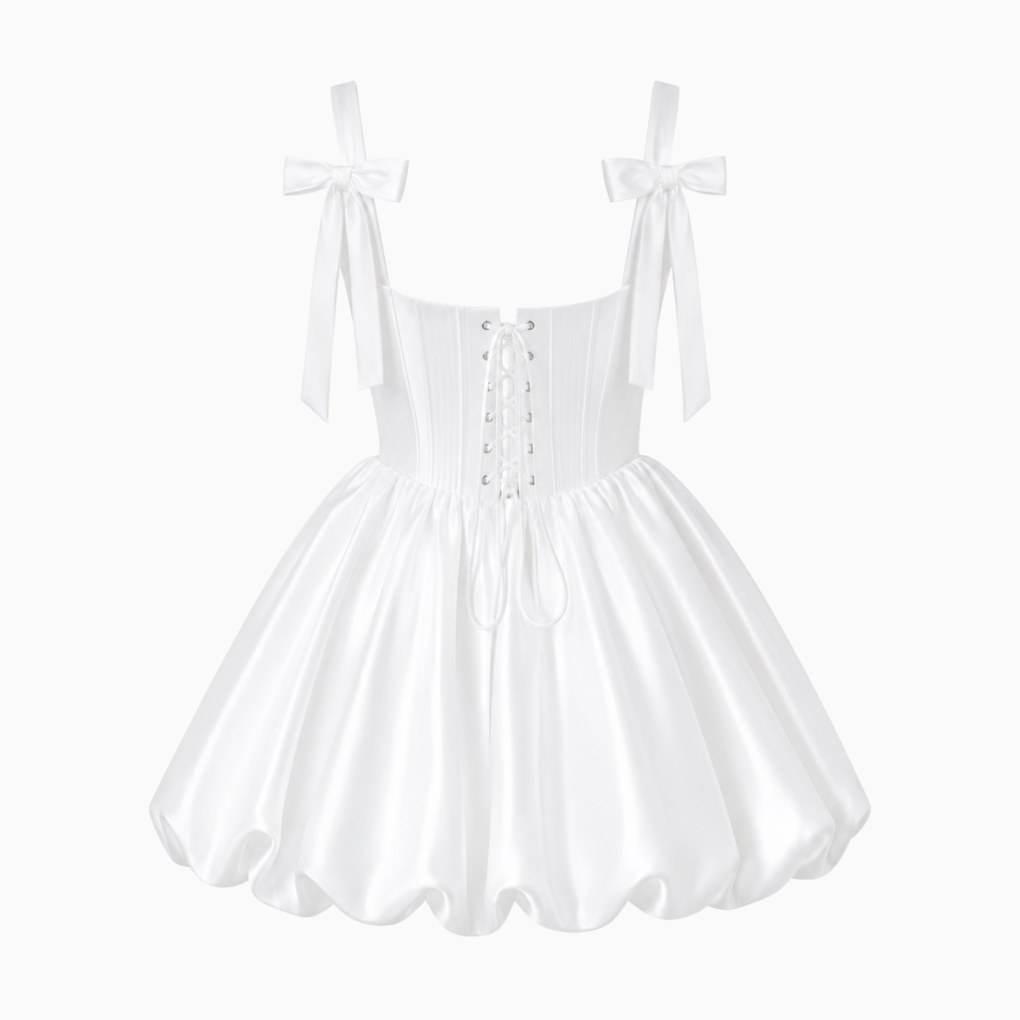 Back flat lay view of a white luxury mini dress displaying the detailed lace-up corset closure and delicate self-tie shoulder straps.