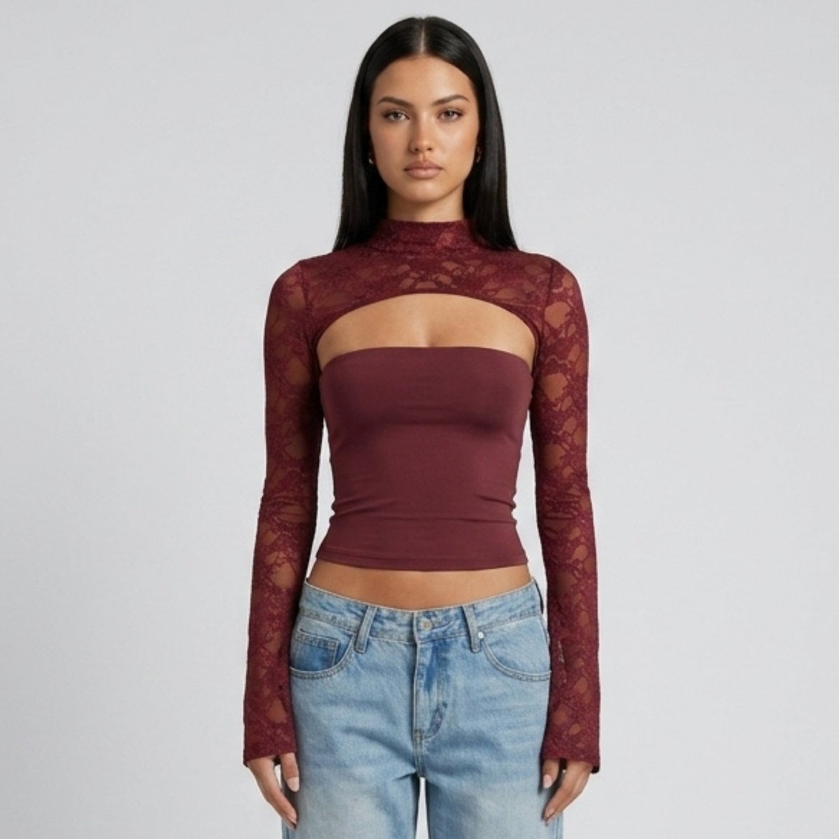 Front view of woman wearing Kouvr wine red lace cut-out long sleeve mock neck top