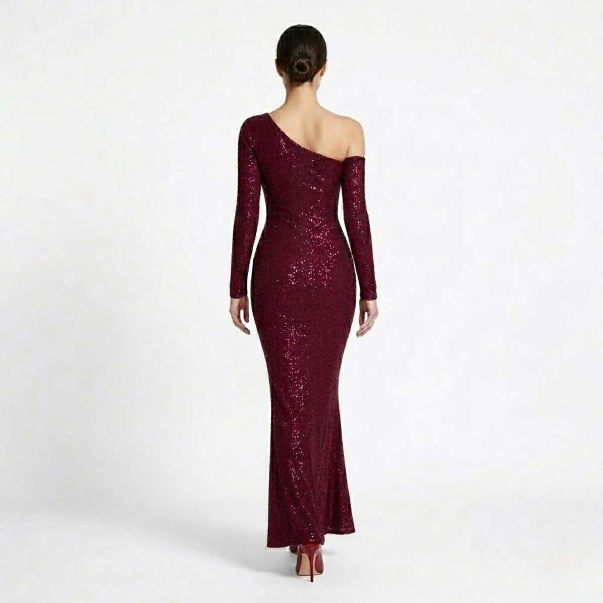 Back view of the Kouvr formal mermaid prom dress showing off-the-shoulder sleeve detail and floor-length hem.