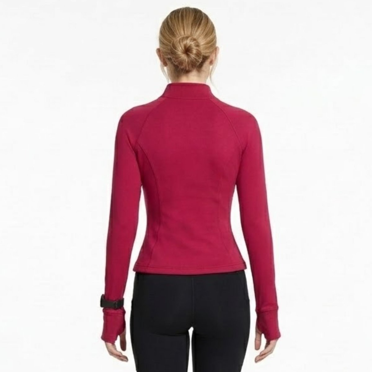 Back view of woman wearing berry red sculpting track jacket showing contoured princess seams
