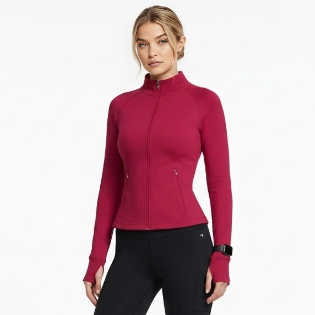 Woman wearing Kouvr premium berry red full zip fitted activewear jacket with thumbholes front view