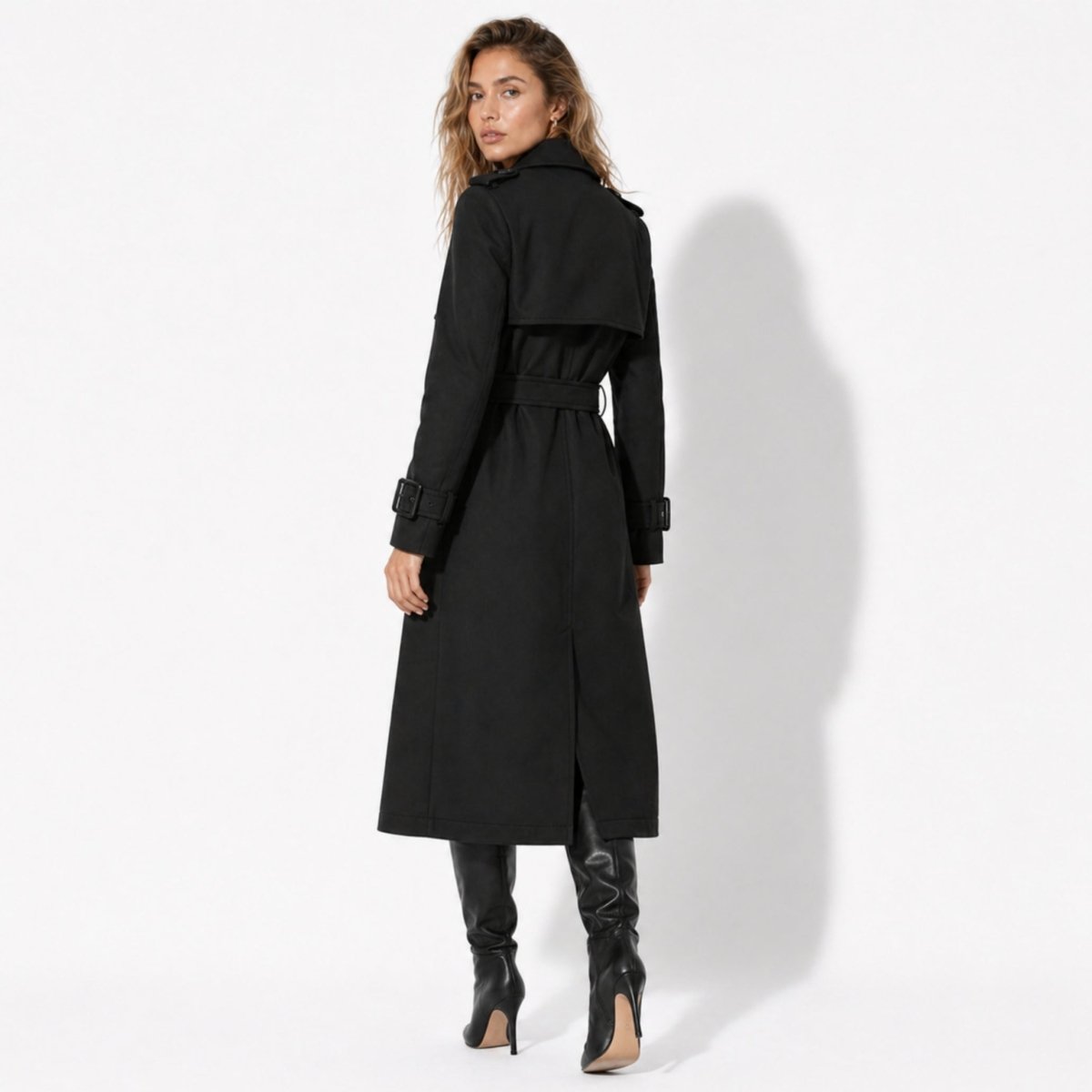 Back view of black trench coat for women showing storm flap and waist belt detail