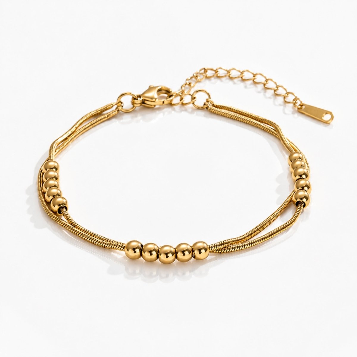 18K gold double layered snake chain anklet with 4mm polish beads on a white background.