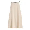 Model wearing Kouvr Akisha natural linen maxi dress with open back tie