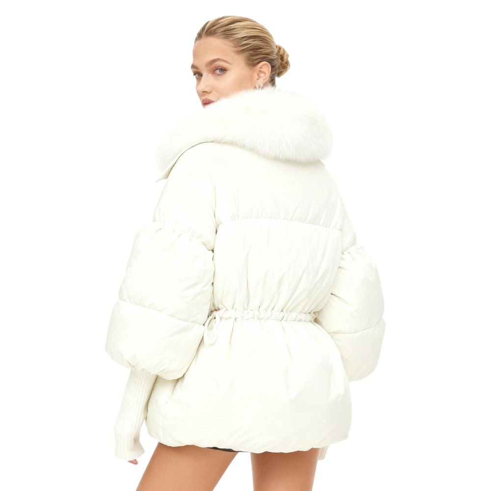 Person wearing a white kouvr puffer coat on a white background