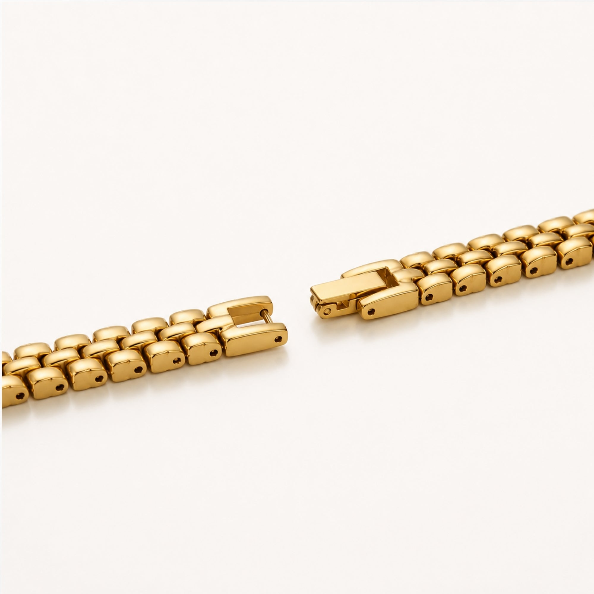 Macro detail showing the premium adjustable gold link bracelet and secure fold-over clasp mechanism of the Kouvr ladies watch.