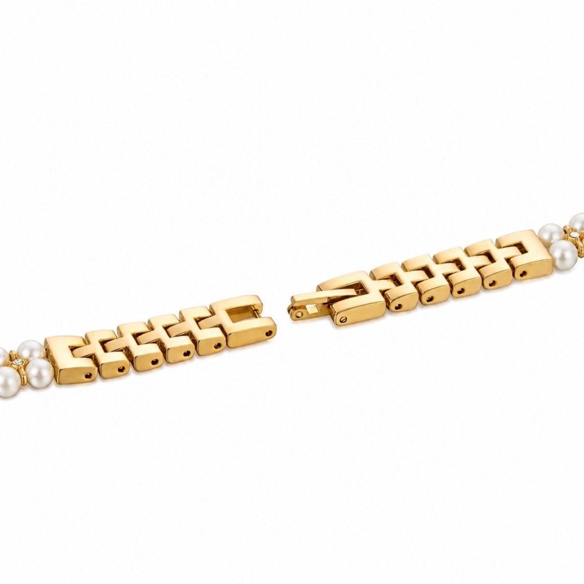 Close up detail shot of the secure, gold-tone adjustable link jewelry clasp on the Kouvr pearl bracelet watch.