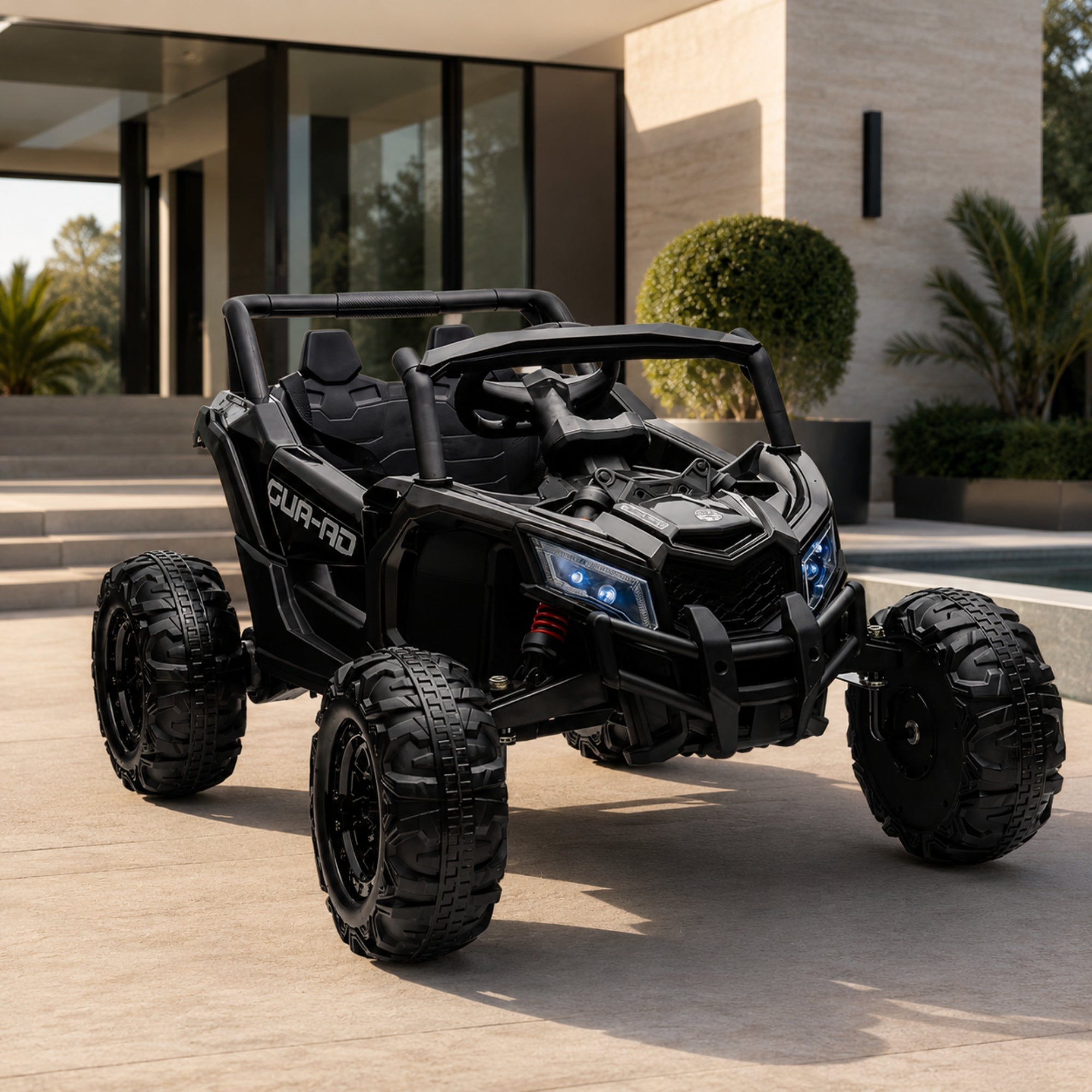 Studio profile shot of a sleek, all-black 24V kids' ride-on electric buggy parked on a modern patio next to a swimming pool.
