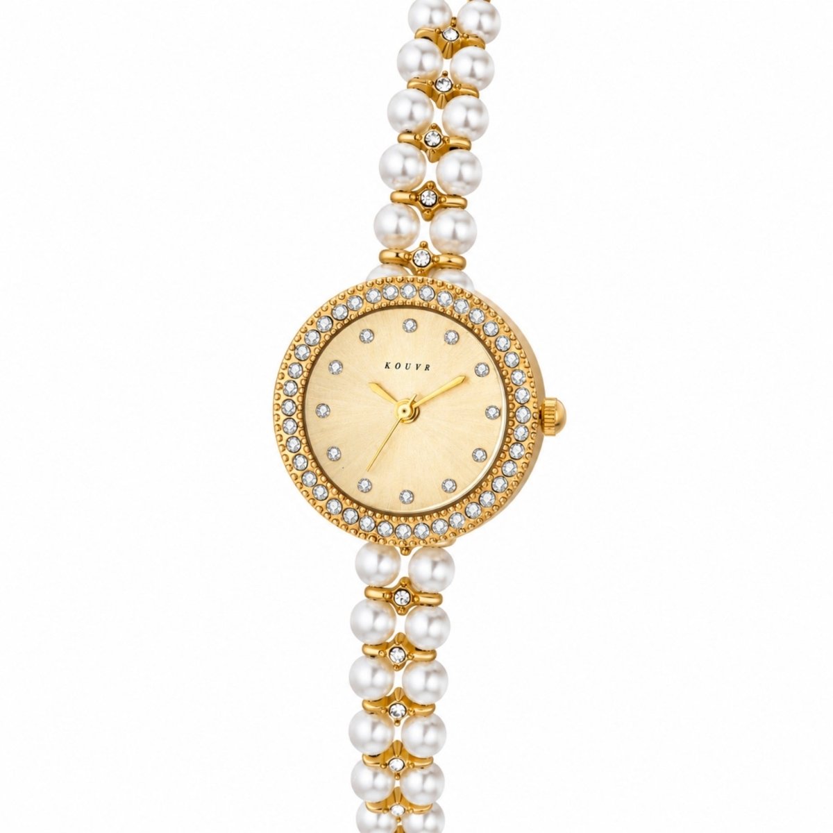 Angled macro view showcasing the sparkling rhinestones, polished gold stainless steel case, and delicate watch hands of the Kouvr vintage timepiece.