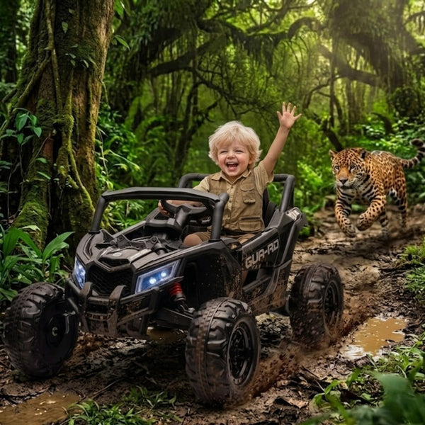 A young boy and girl laughing while driving a black 24V battery-powered toy UTV on a dirt mountain trail with a grizzly bear behind them.