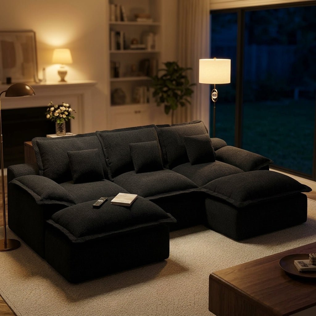 Black modular pit sofa with corduroy fabric assembled in a home living room on a natural jute rug.