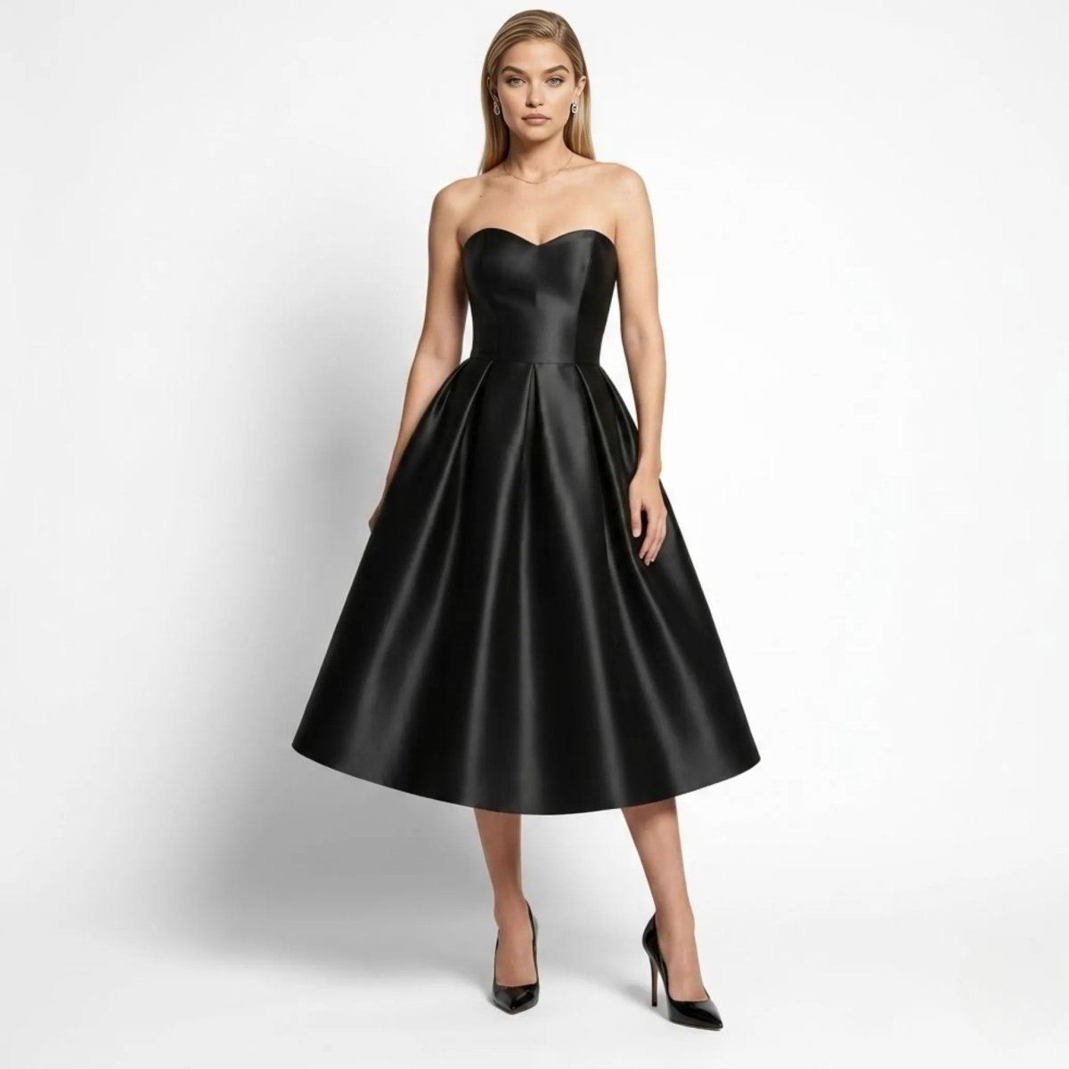 Front view of woman wearing elegant black satin strapless sweetheart neckline midi cocktail dress by Kouvr