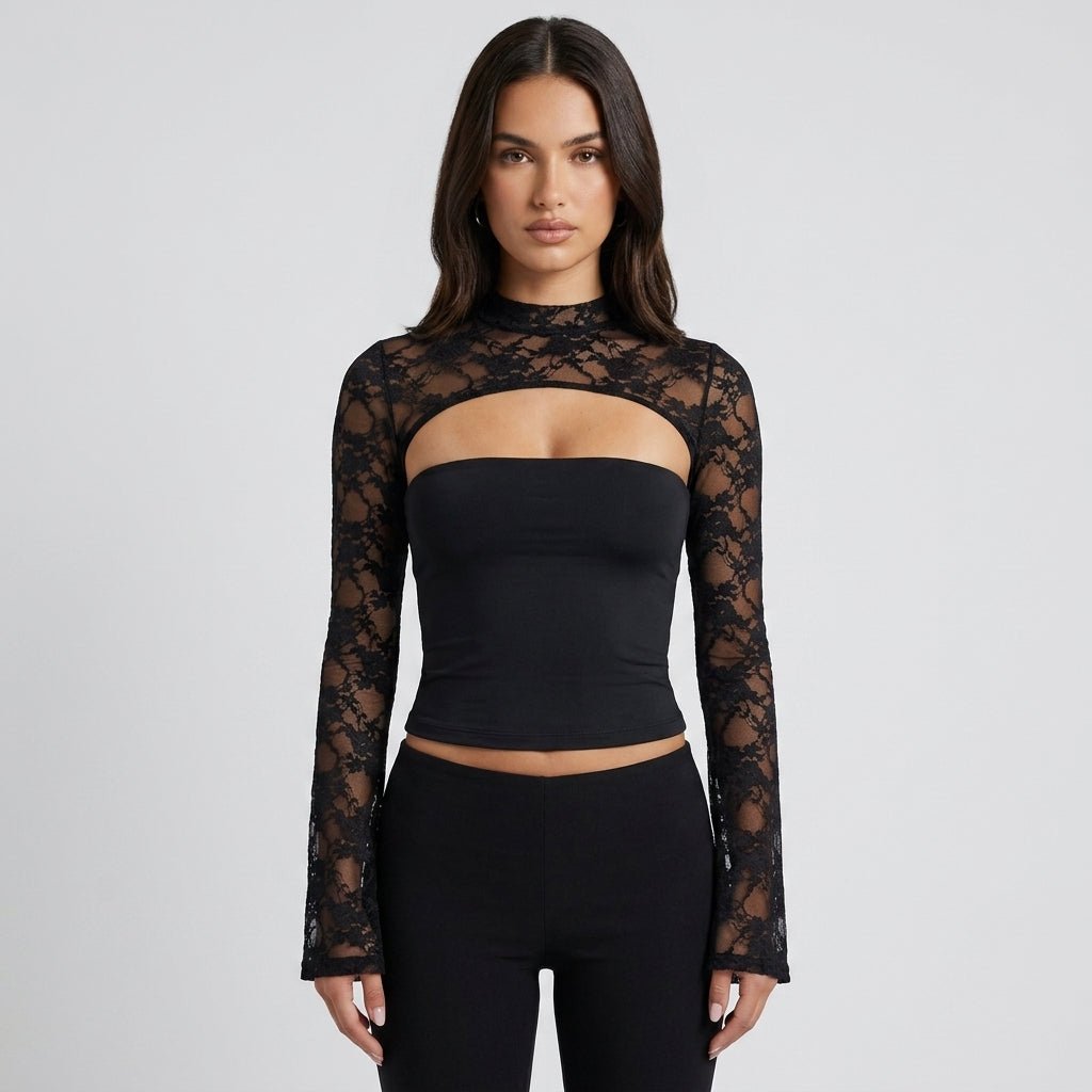 Front view of woman wearing a black sheer lace long sleeve top with a high neckline and chest cutout styling paired with dark trousers.