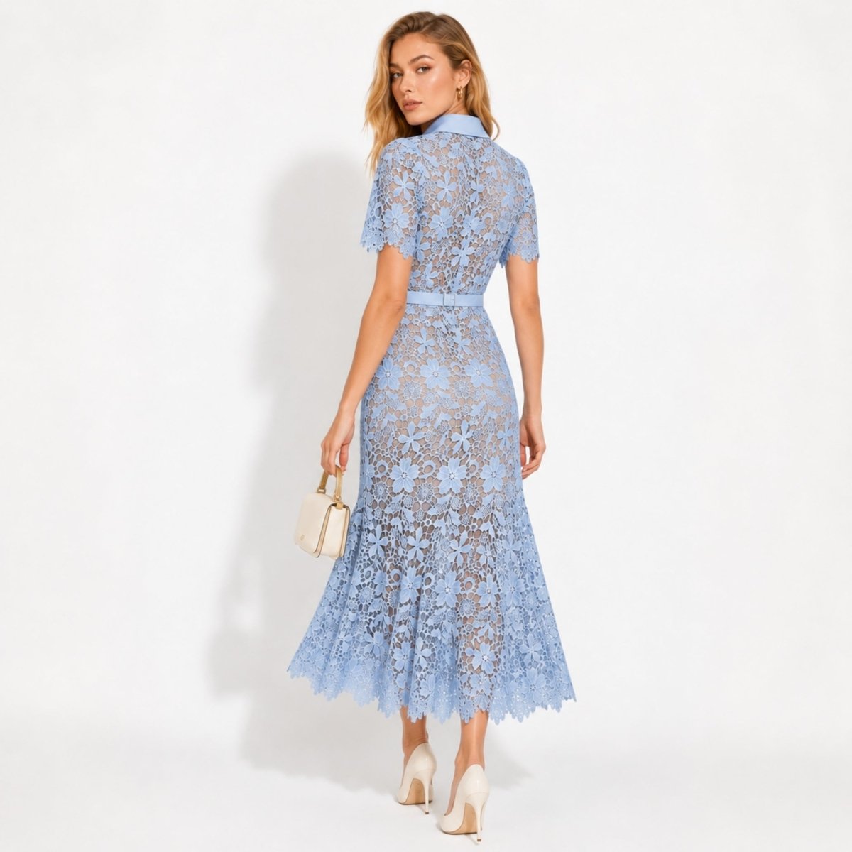  Back view of elegant blue lace collared midi dress with nude lining.