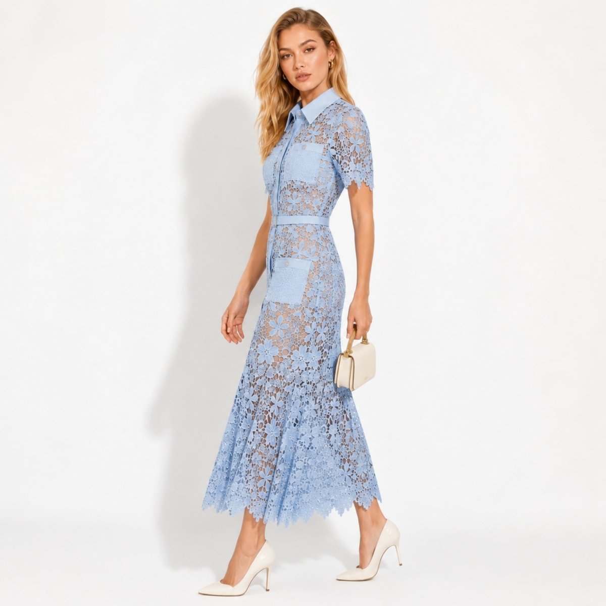 Side angle of blue floral lace midi dress showing fit and flare silhouette.