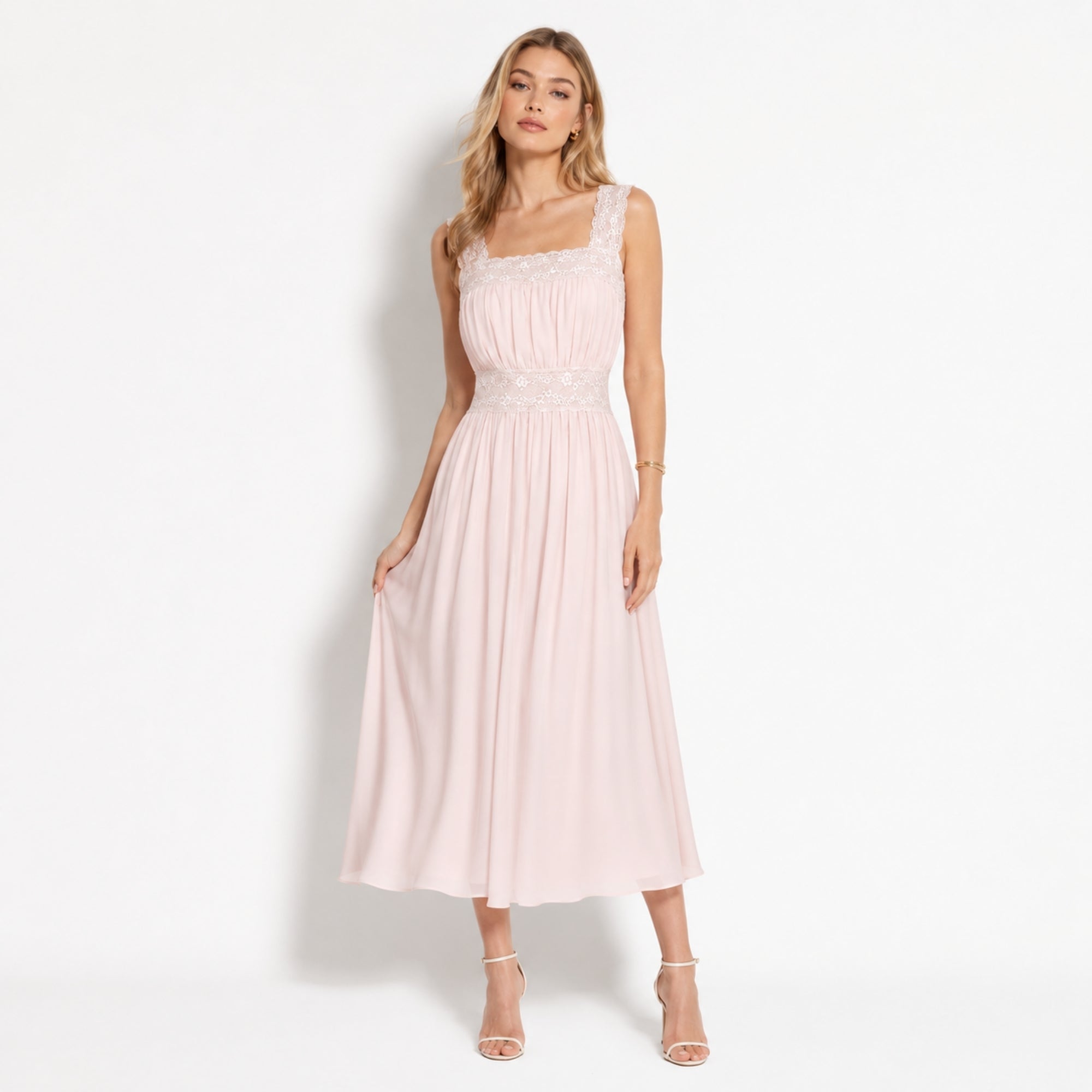 Woman wearing Kouvr blush pink lace trim square neck pleated chiffon midi dress standing gracefully