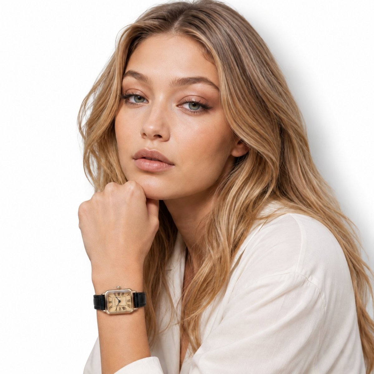 Woman in a casual white button down shirt wearing a classic black leather tank style watch.