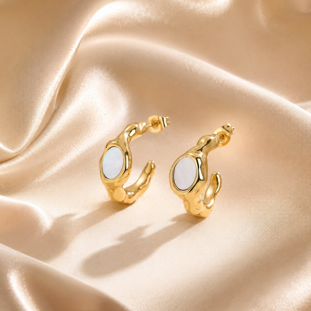 Jewelry size guide showing the exact dimensions of the chunky gold hoop earrings measuring 20 millimeters tall and 9 millimeters wide.