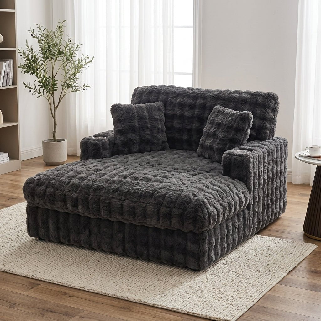 Dark grey oversized pull-out loveseat positioned beautifully in a bright, modern organic living room setting