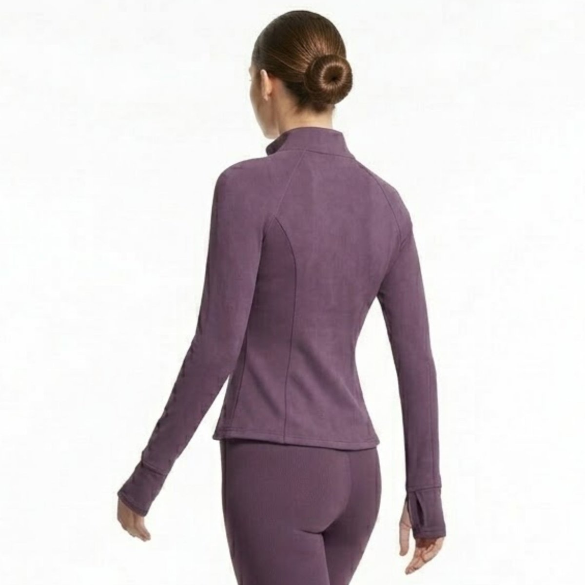 Woman wearing Kouvr dark  purple form-fitting zip-up activewear track jacket back view showcasing contouring seams