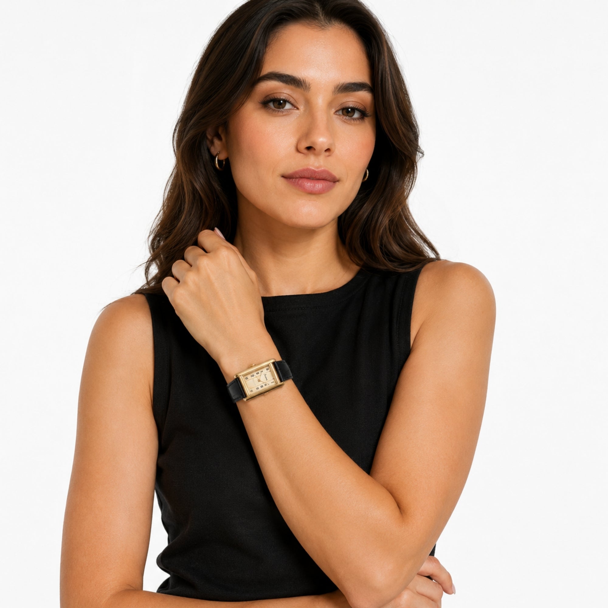 Elegant female model wearing the Kouvr vintage gold rectangular watch with black leather strap paired with a classic black top.