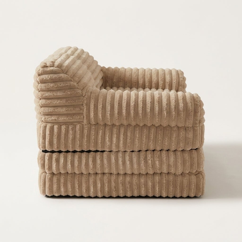 Side profile of the Kouvr corduroy floor sofa showing its compact three-tier folded space-saving design.