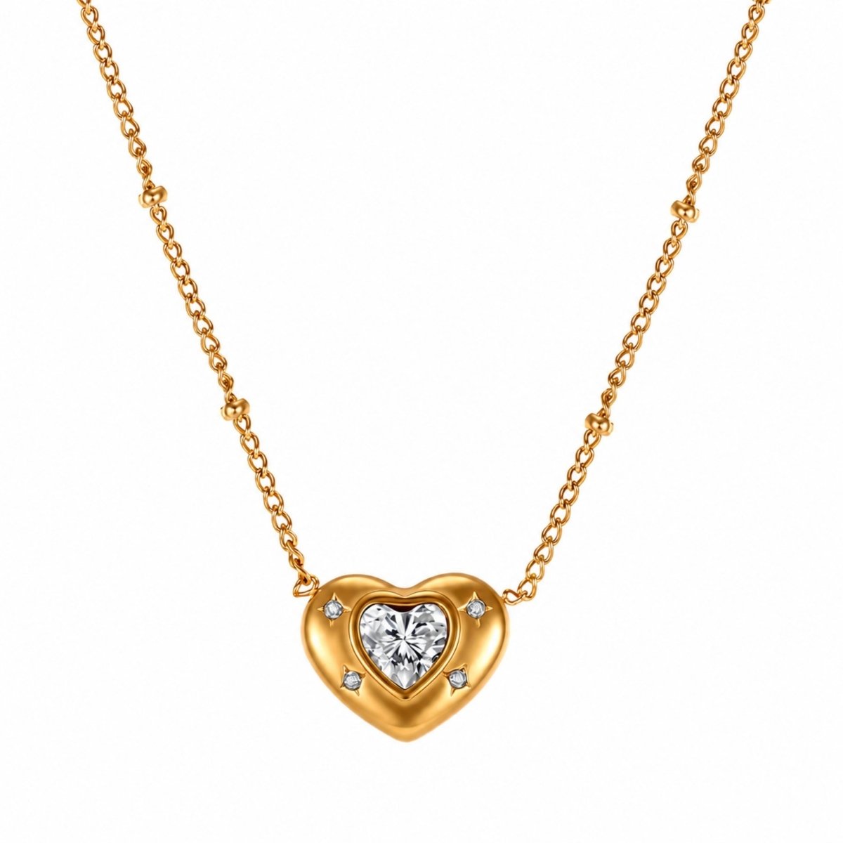 Close-up of Kouvr gold heart pendant necklace featuring a central crystal and dainty beaded satellite chain.