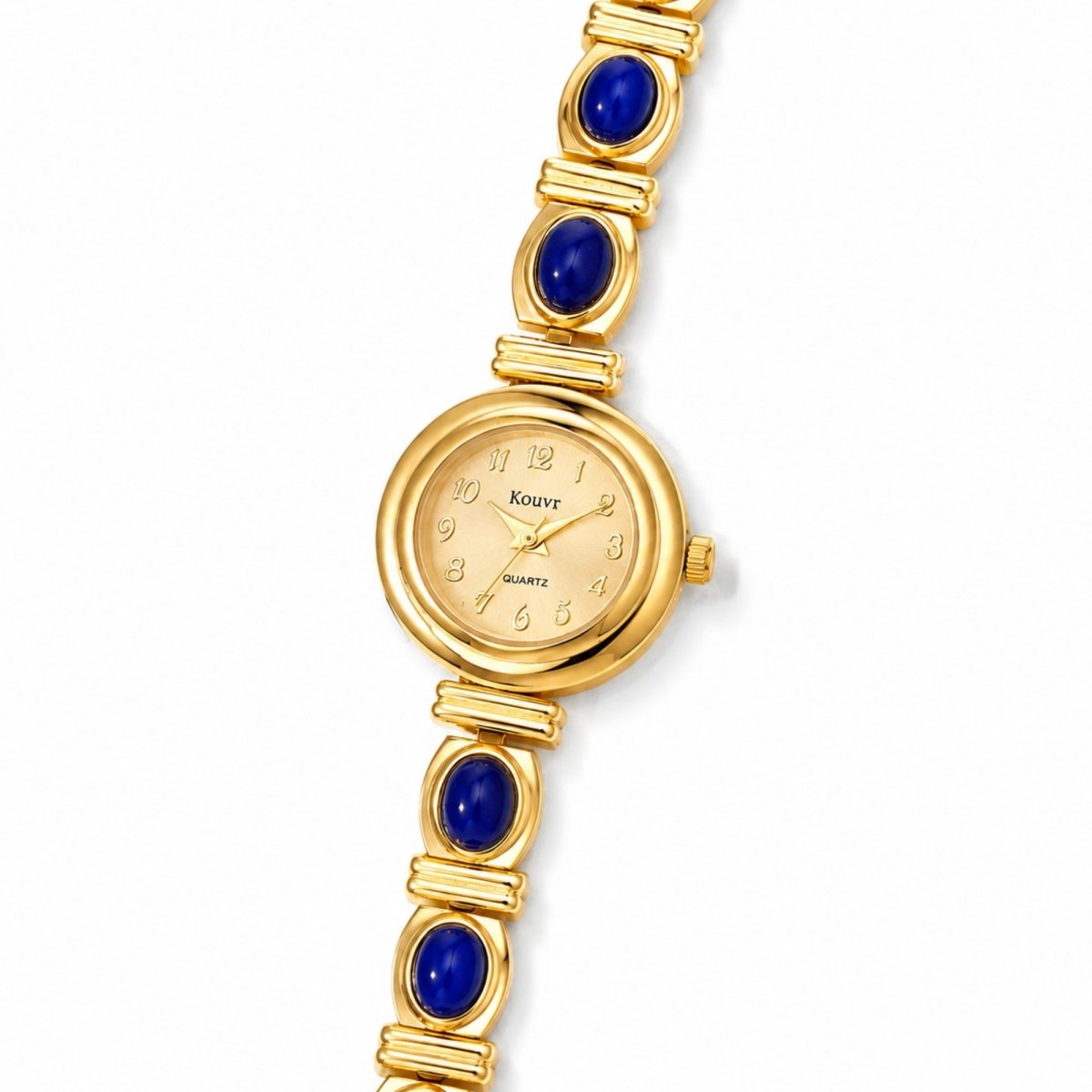 Angled close-up of the Kouvr gold stainless steel jewelry watch, highlighting the vintage style casing and the polished, scratch-resistant crystal glass.